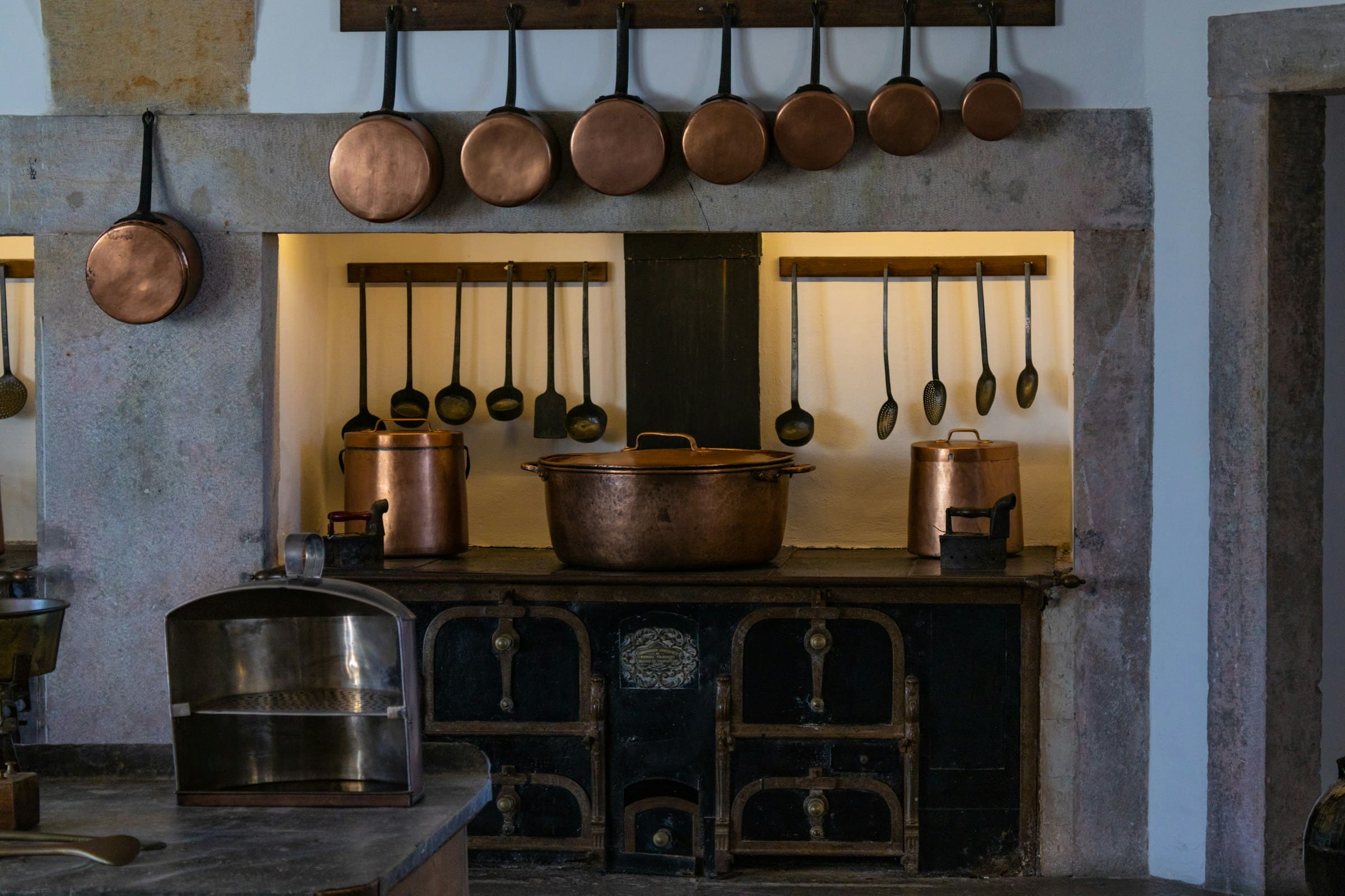 Copper pans hanging in an old kitchen
